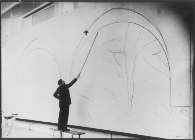 Henri-Matisse-works-on-Danse-II-at-the-Barnes-Foundation.-Matisse-attached-charcoal-to-the-end-of-a-long-branch-of-bamboo-while-completing-the-underdrawing-for-the-mural.jpg