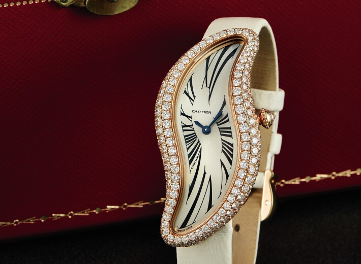 A Cartier Baignoire women's watch with diamonds in an auction selling Cartier watches