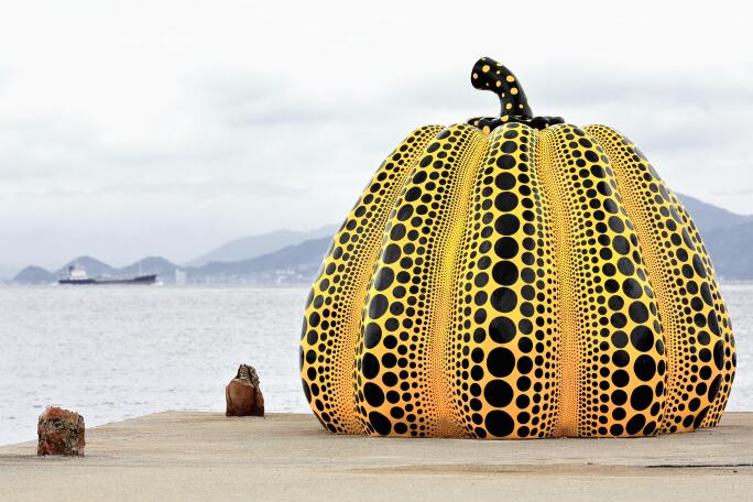 Naoshima, Japan-October 19, 2013: Naoshima island exposes several artworks at open air among them Yayoi Kusama's Yellow Pumpkin sculpture.