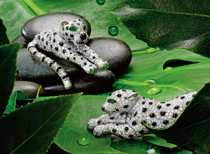 Cartier panther jewelry with diamonds and onyx in an auction selling Cartier brooches
