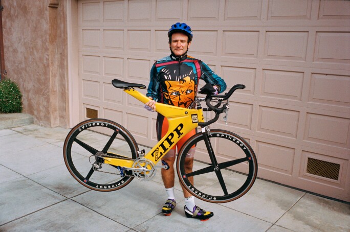 Robin Williams with a bike