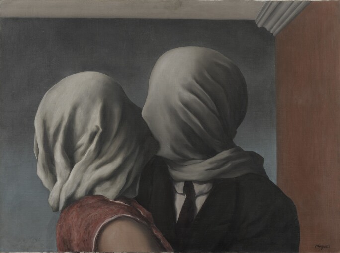 A man and woman kissing with white sheets over their heads.