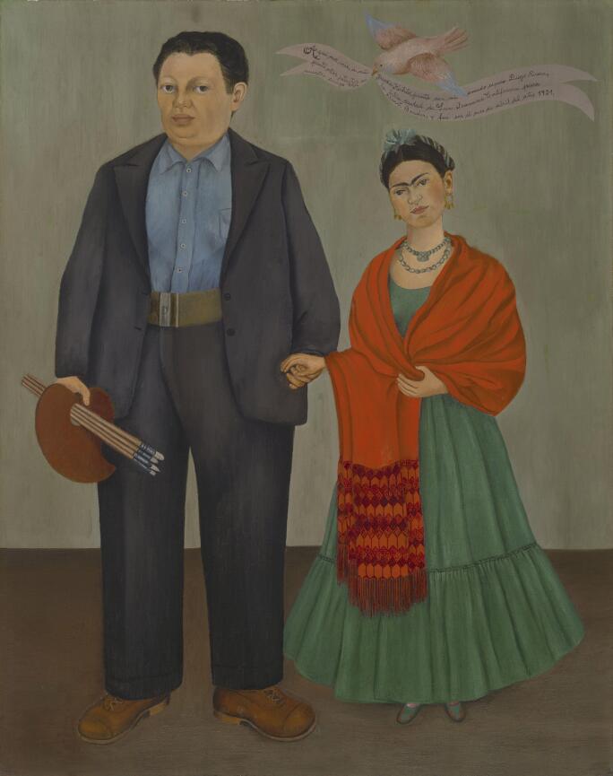 Frieda Kahlo standing next to Diego Rivera in a wedding portrait she painted
