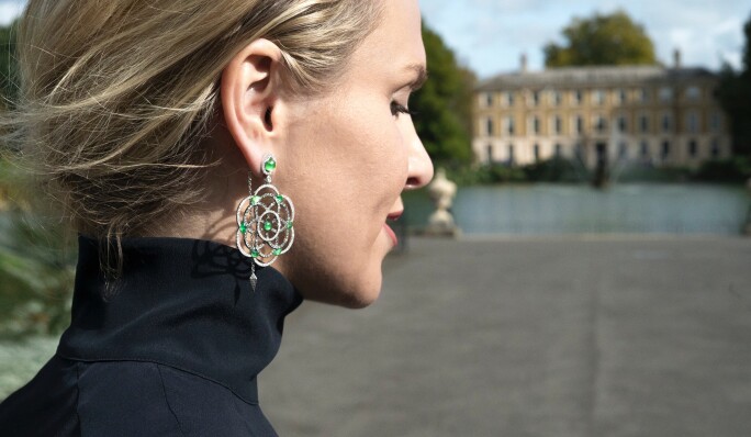 Lily Gabriella wearing white and grey diamond Damali earrings with hand cut green tsavorites from her own collection