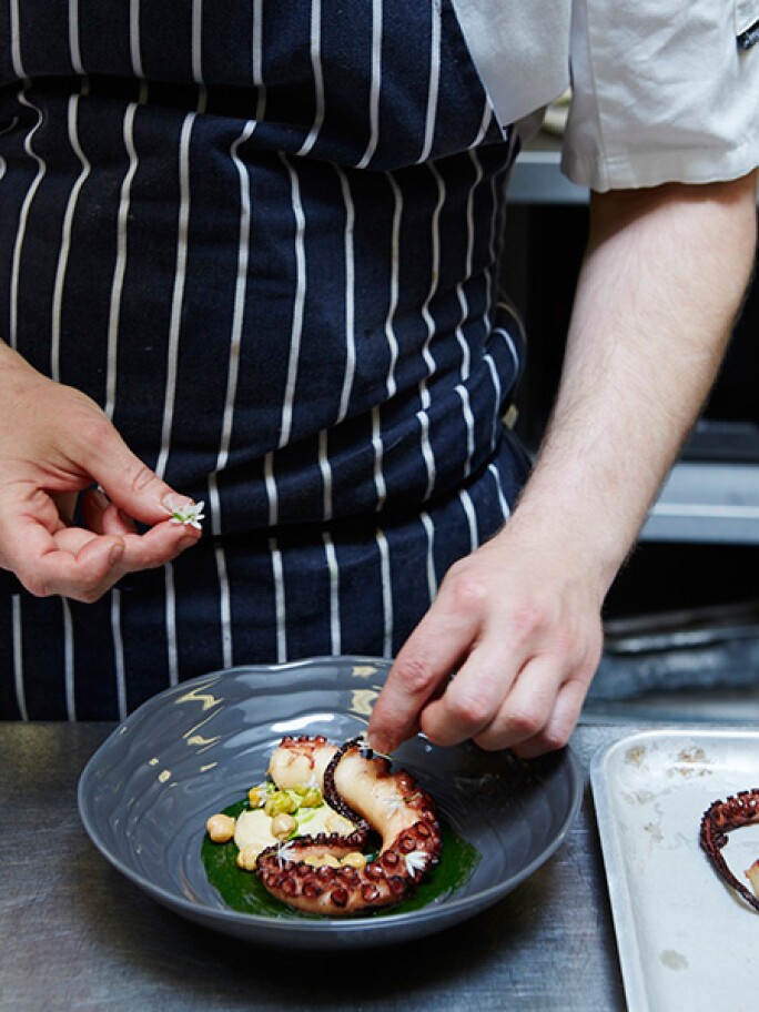 CHARRED OCTOPUS, CHICKPEA, DILL CHUTNEY, FORAGED WILD FLOWERS, a dish available at Sotheby's Restaurant