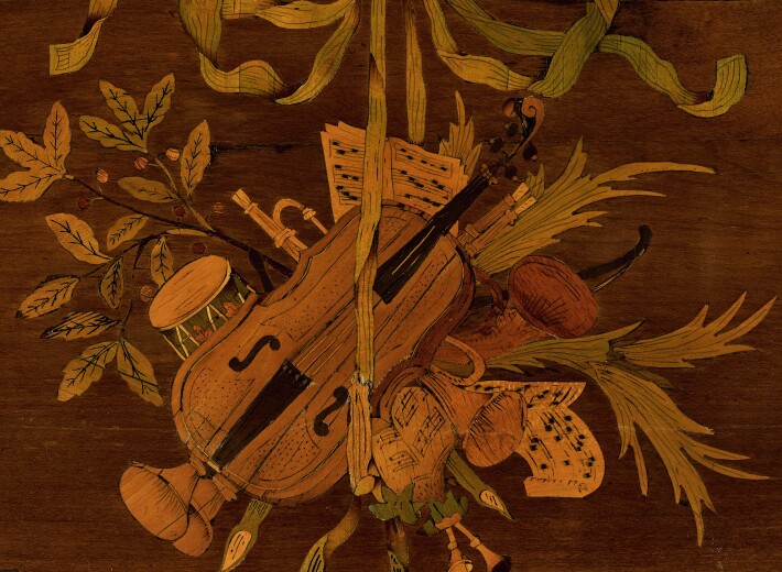 French 18th century table with marquetry design in an auction selling antique french furniture