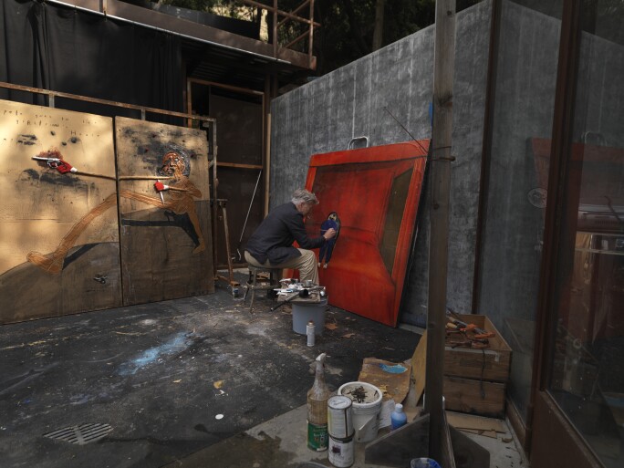 David Lynch in his studio, with Pete Goes to His Girlfriend's House, 2009, in the background