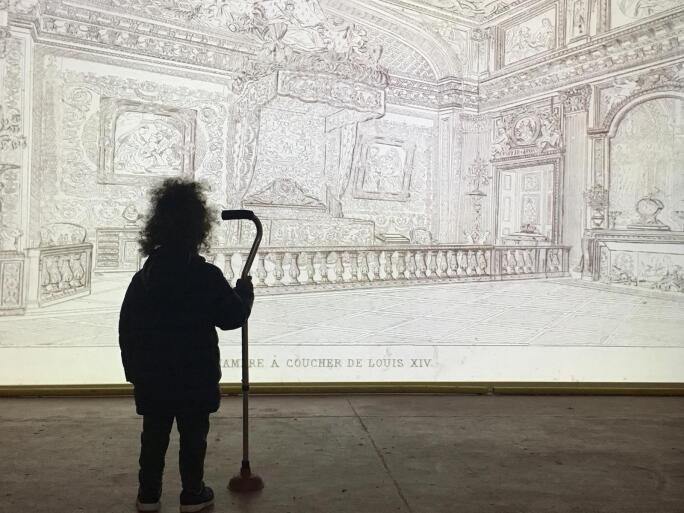 Image of Child in front of Illustration at Zumu