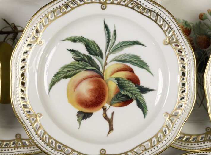 Royal Copenhagen fruit plate in an auction selling Royal Copenhagen china