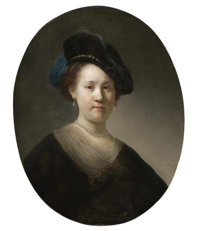 A portrait of a woman with a black velvet cap and a blue plume.