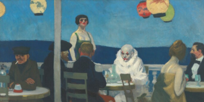 Seaside cafe with a clown seated at a table in full makeup with white face mask smoking a cigarette.